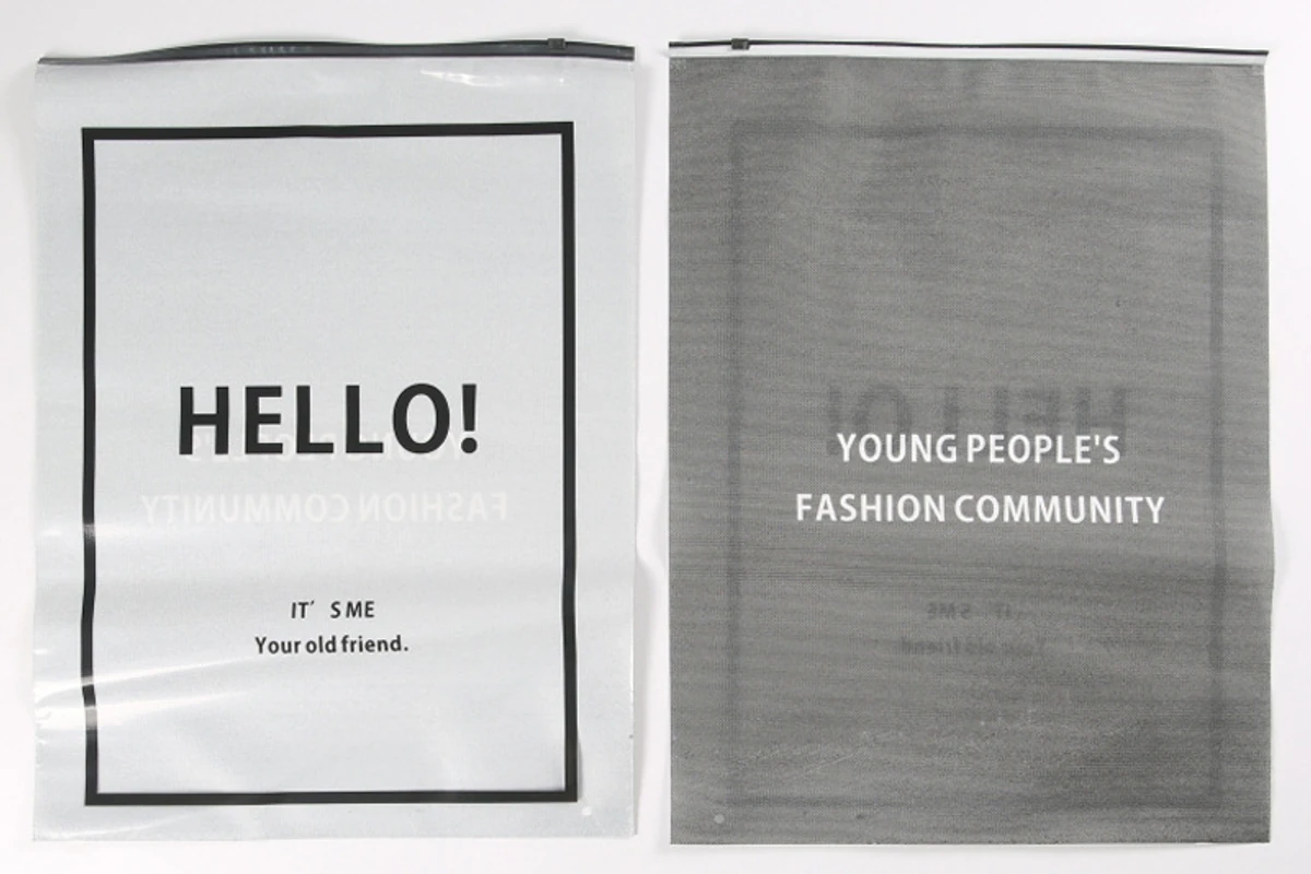 Clear packaging bags with black printed brand designs.