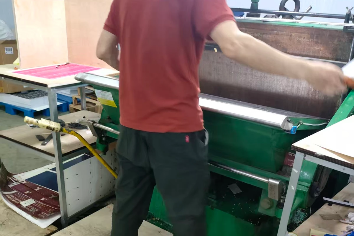 An operator at a flat-bed production workstation.