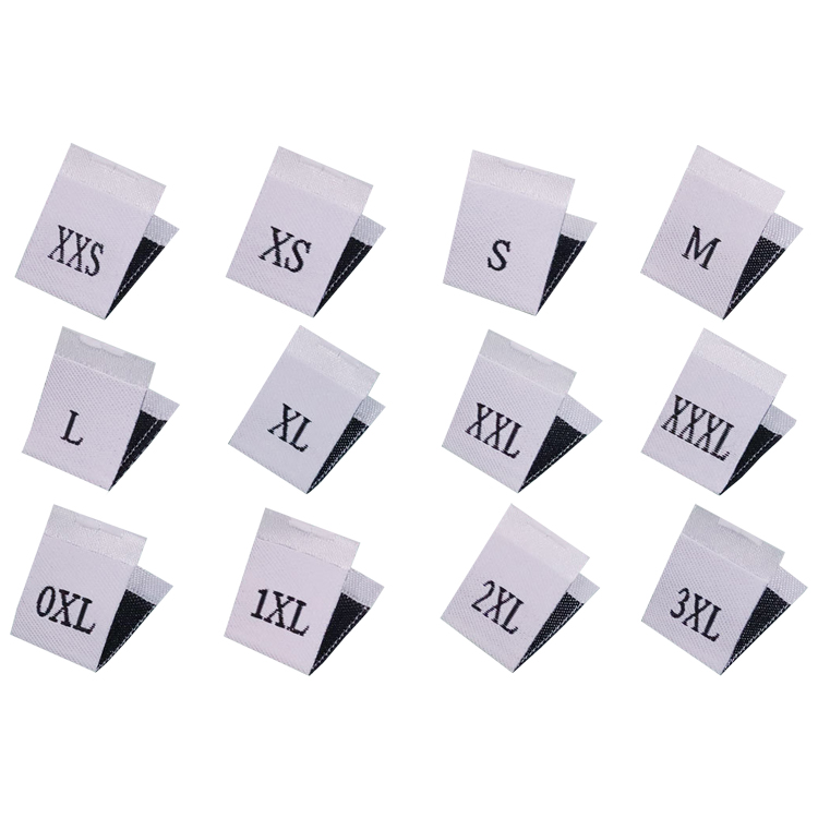 White folded fabric labels with printed size markings.