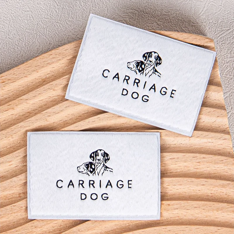 White woven brand labels with a dog logo.