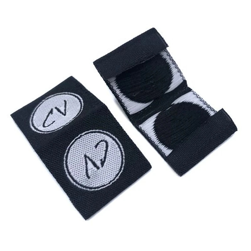 Small loop-folded fabric brand labels.