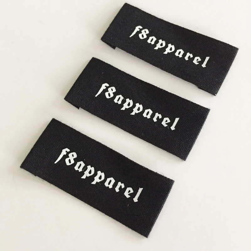 Black folded brand labels with white lettering.