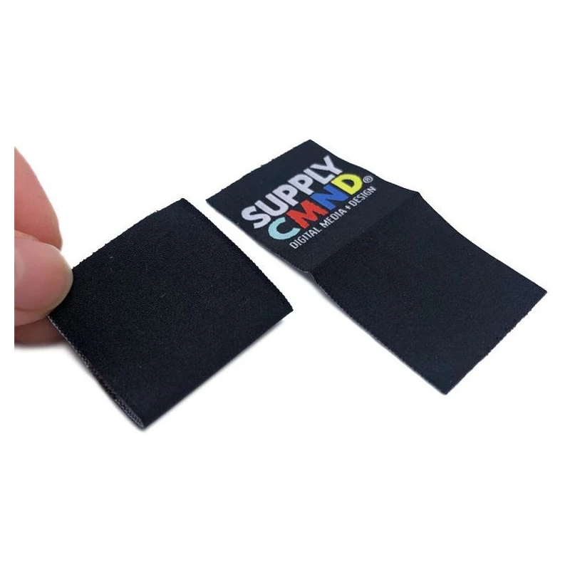 Folded fabric brand tag showing its two faces.