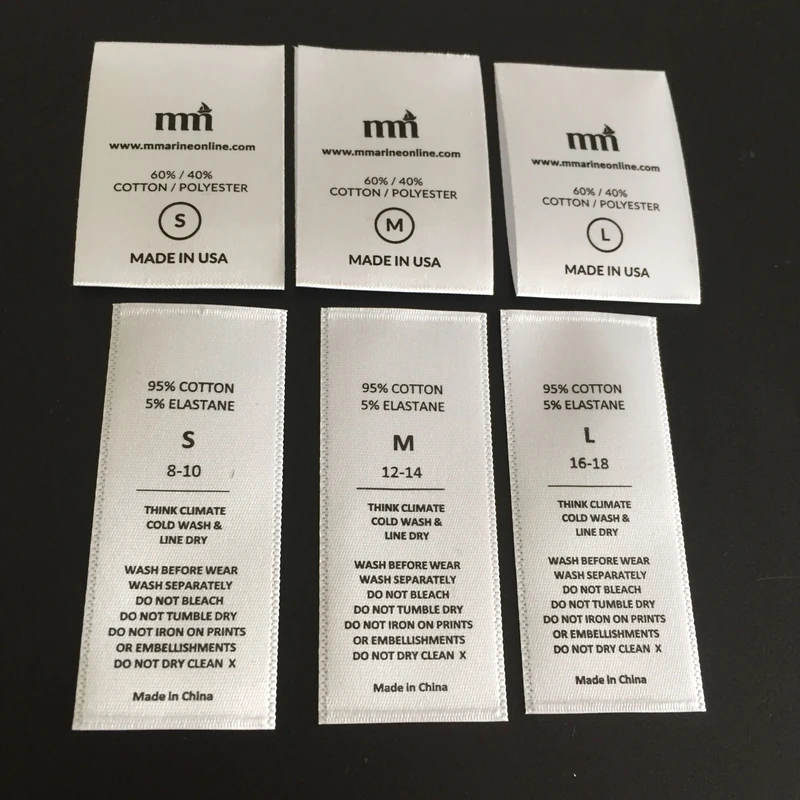 Cream fabric label samples with care and composition information.