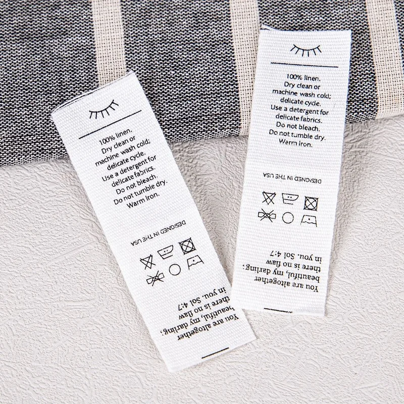 Cotton care labels printed with washing information.