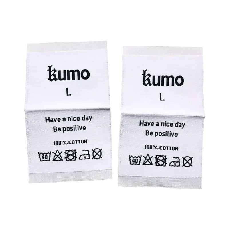 White care labels with overlapping folded sections.