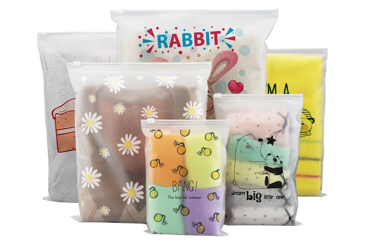 Zipper packaging-bag samples with several printed designs.