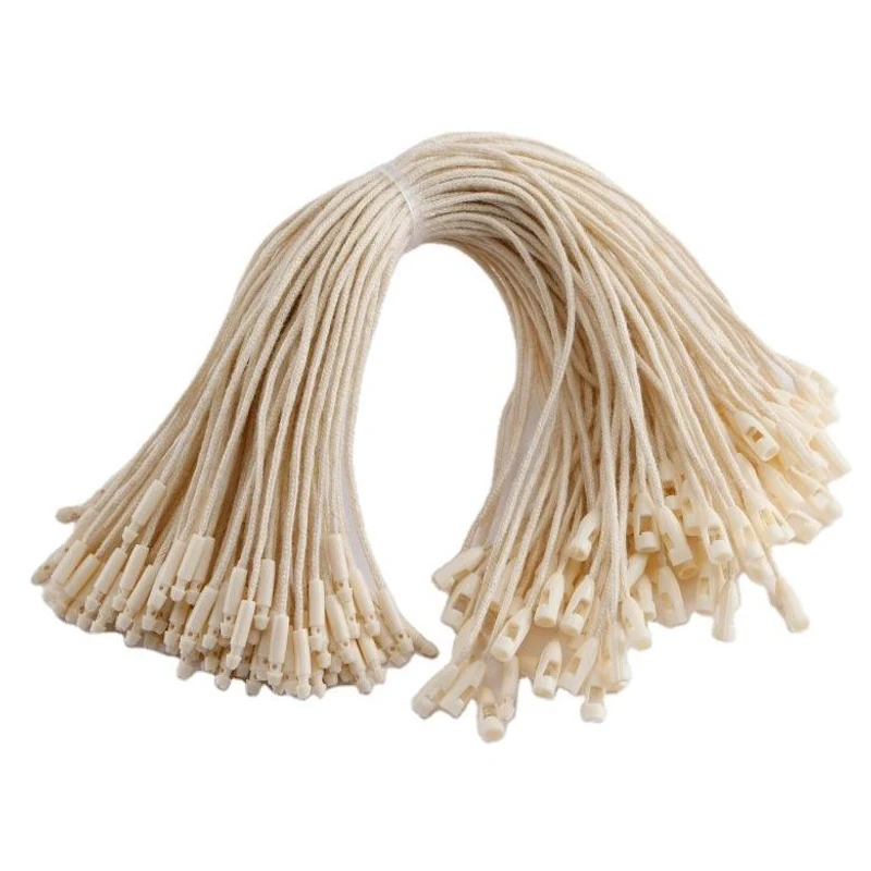 A bundle of beige tag cords with light locking ends.