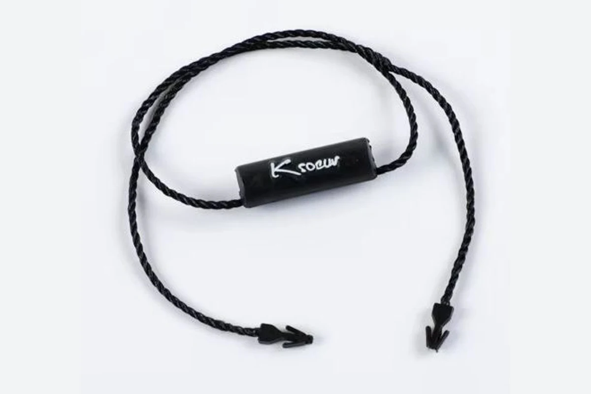 A black tag loop with a rectangular logo piece and separate locking ends.