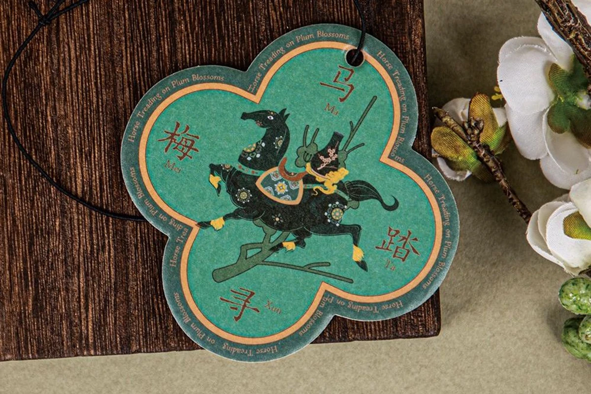 Flower-shaped paper hang tag with multicolor horse artwork and a black cord.