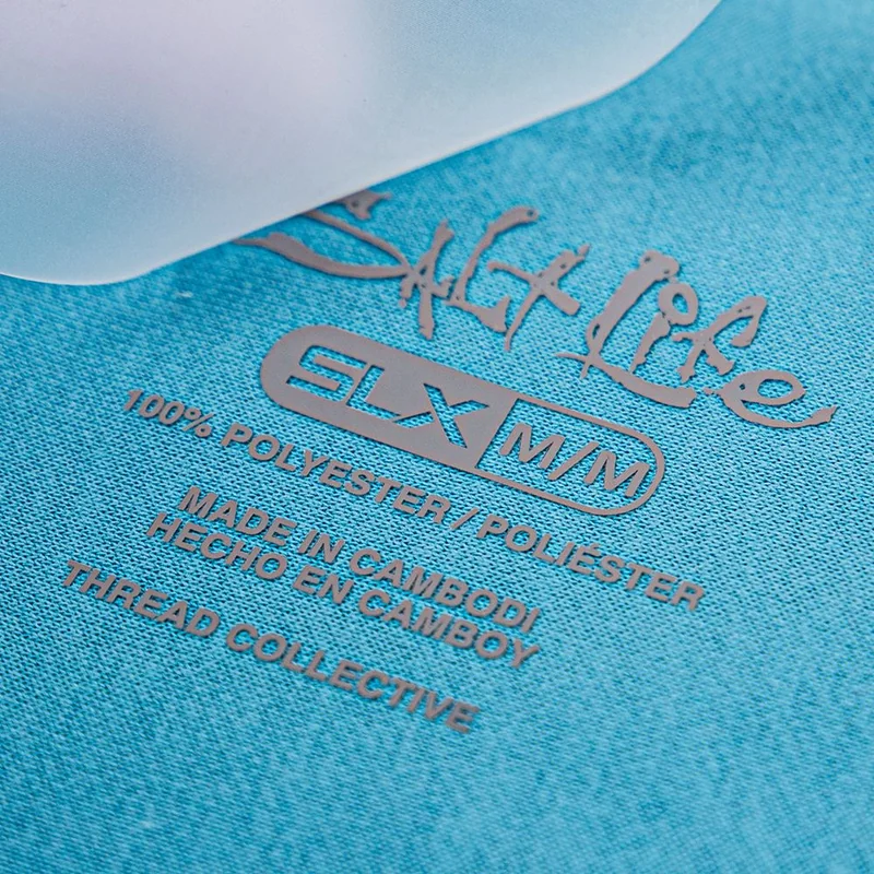 Transfer lettering applied to teal knit fabric.