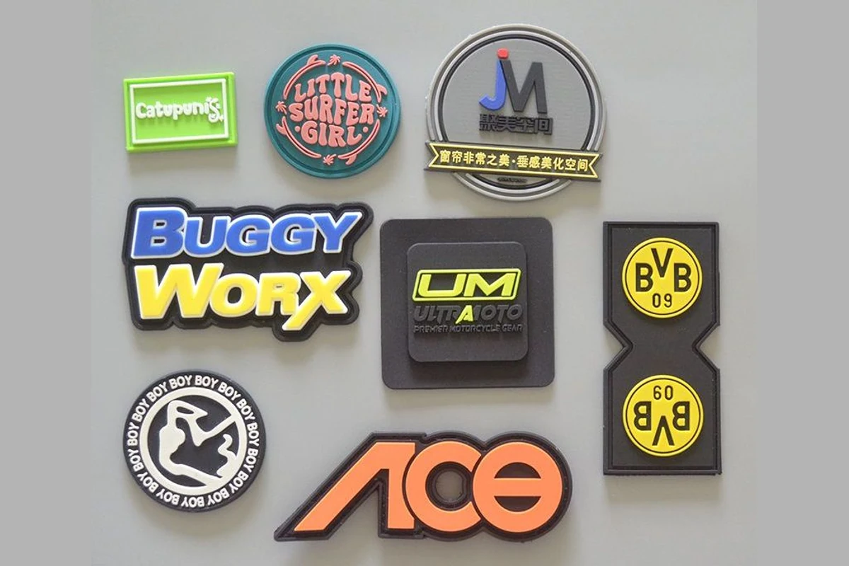 Molded label samples showing varied colors, outlines and logo details.