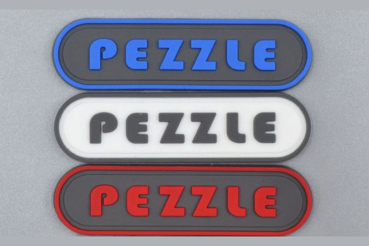 Three rounded rectangular label samples with contrasting colored lettering and borders.