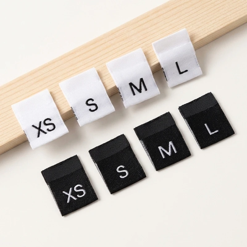 Square black and white size label tabs.
