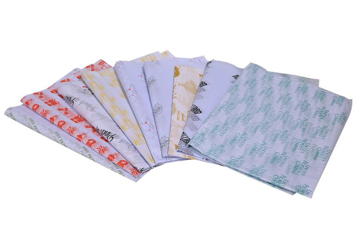 Folded wrapping-paper samples in several printed designs.