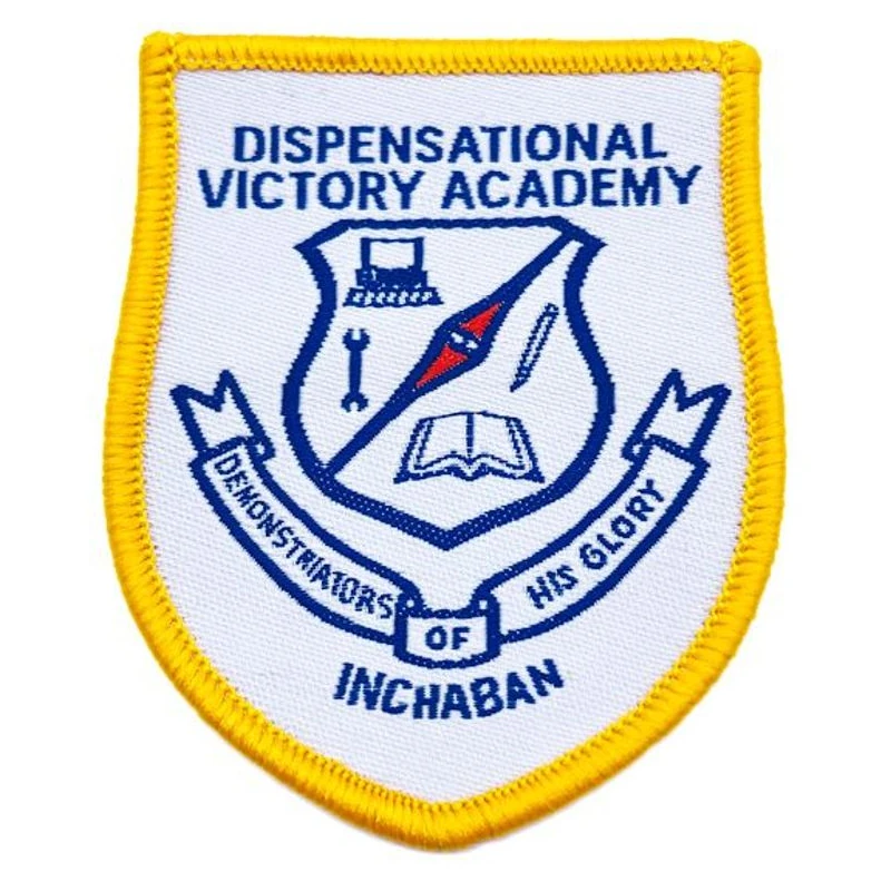 Shield-shaped woven patch with a yellow stitched border.