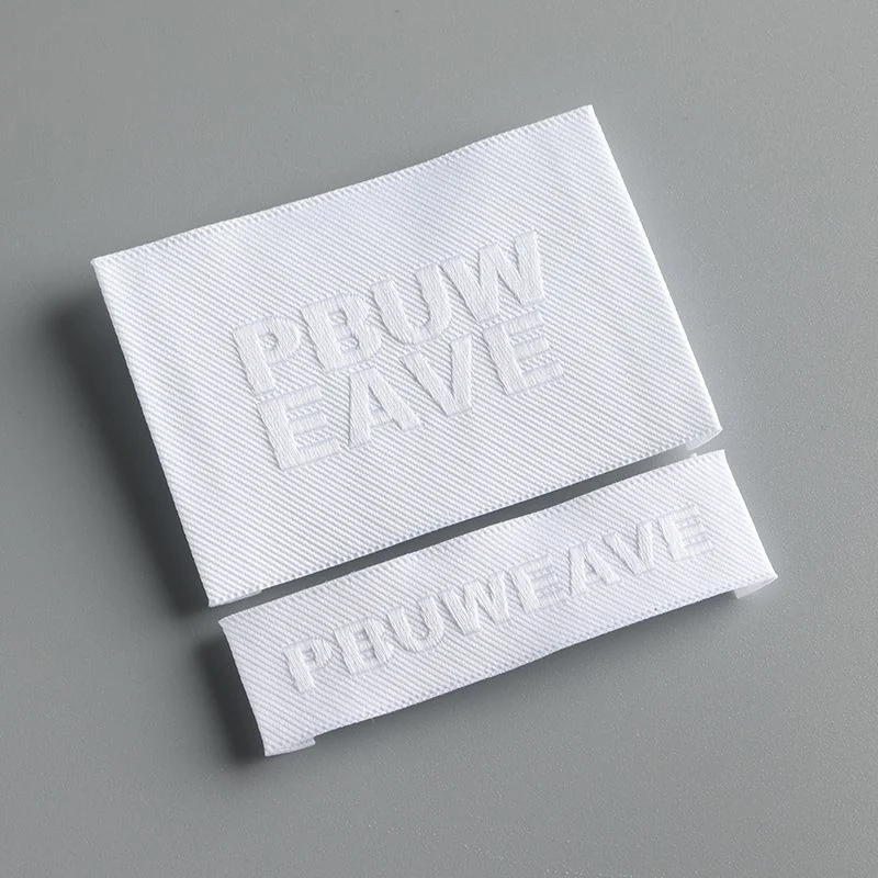 White woven labels with clean-cut outlines.