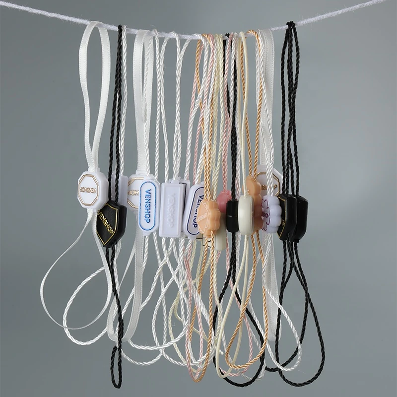 Close-up of tag cords with differently shaped fasteners.