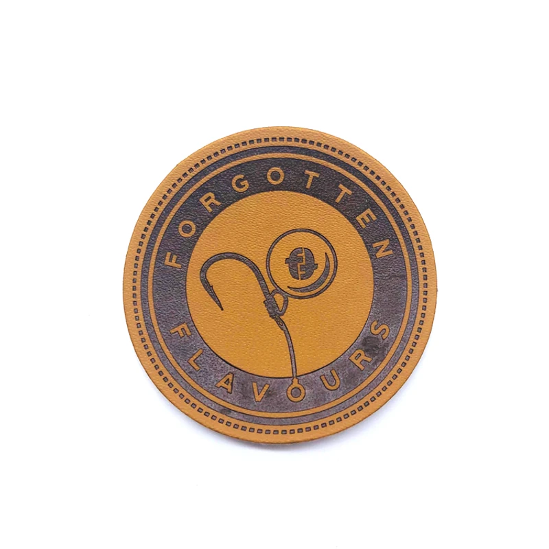 A round logo label with an impressed design and a contrasting border.
