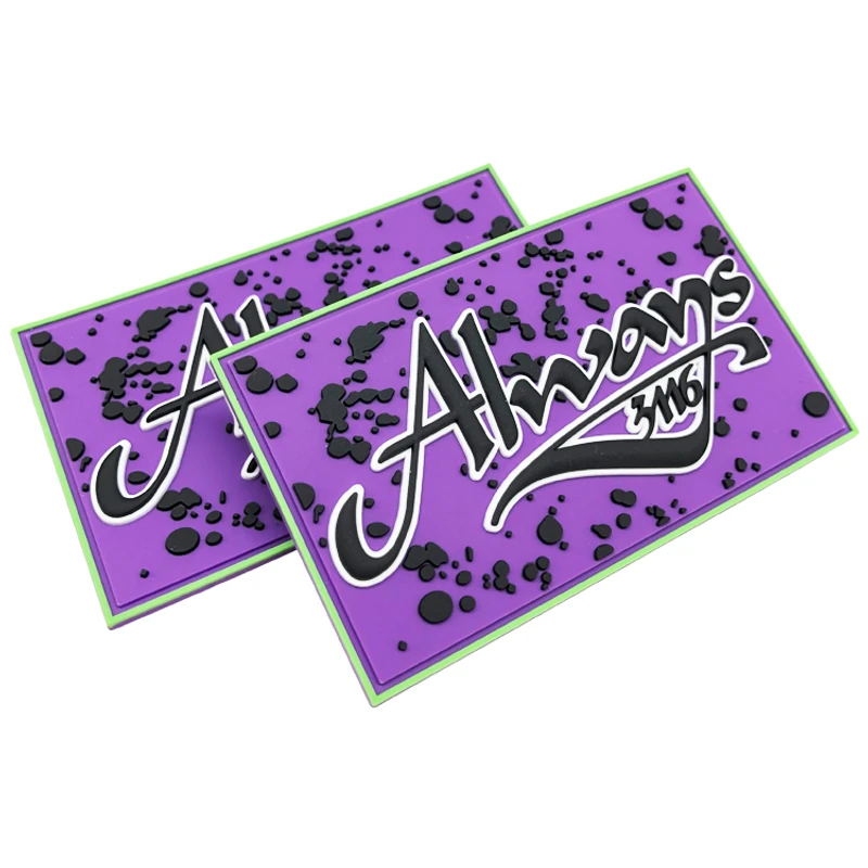 Purple rectangular molded labels with contrasting raised artwork.