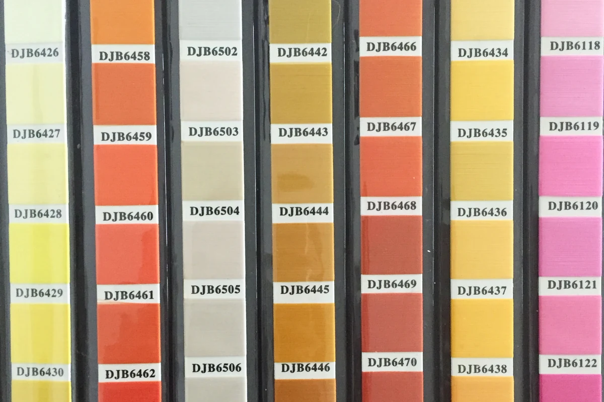 Close-up of fabric color swatches for comparing label designs.