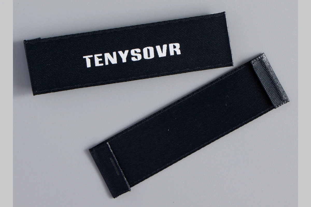 Black end-fold fabric labels with white printed lettering.