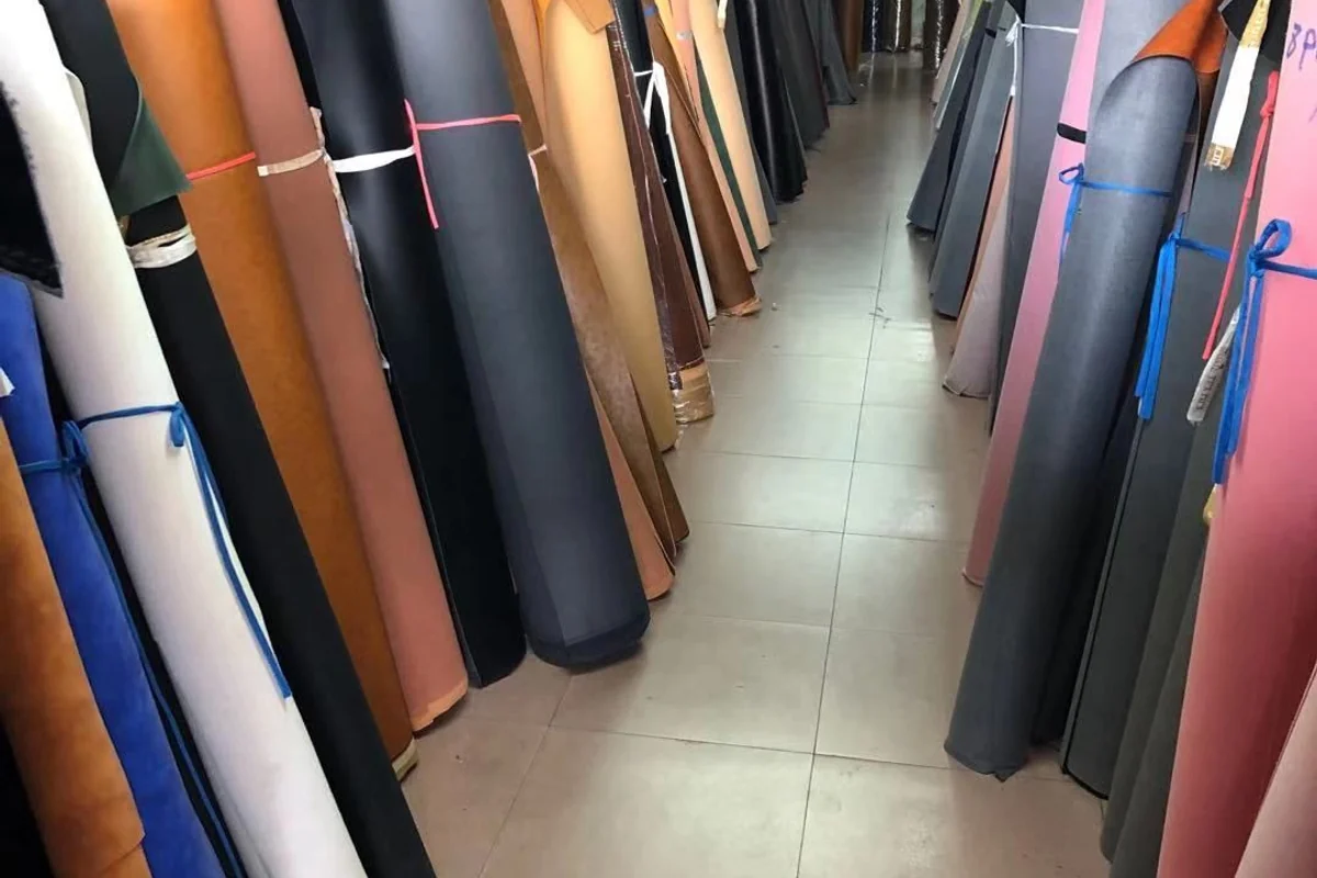 Rows of material rolls stored before production.