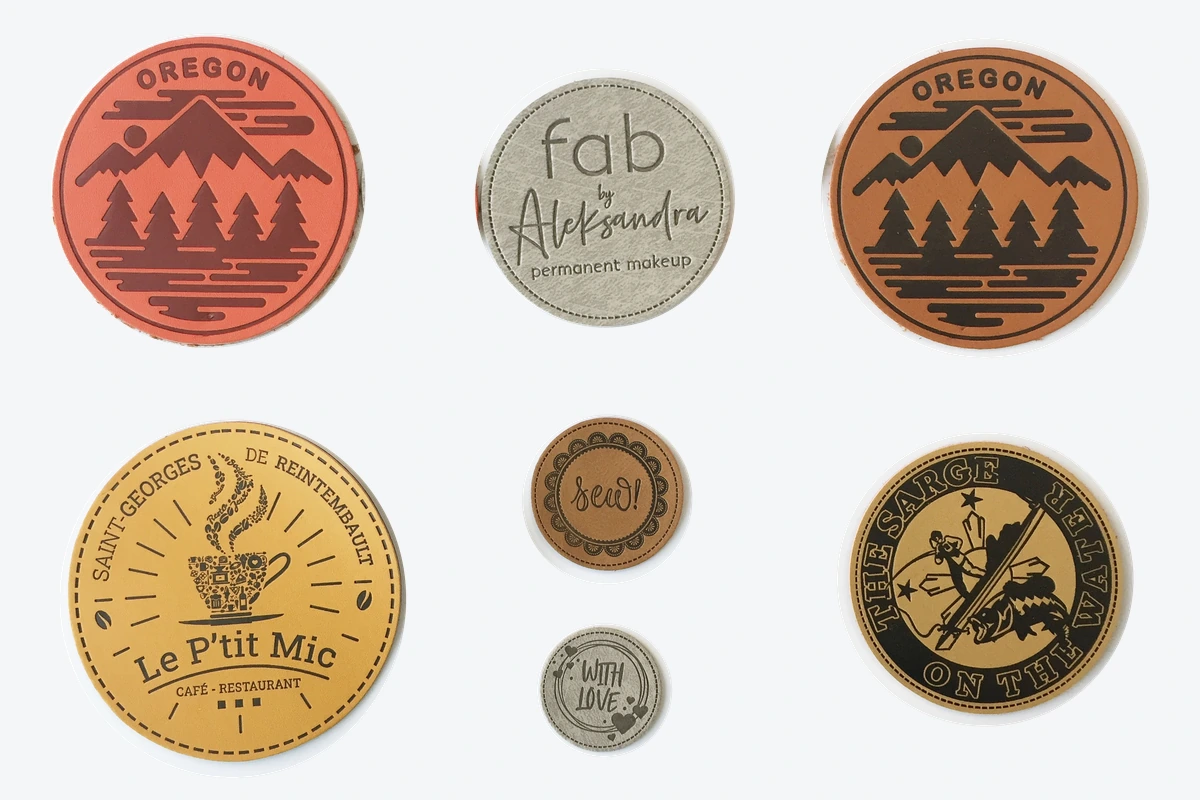 Design reference arrangement of round leather-label samples with decorative designs.